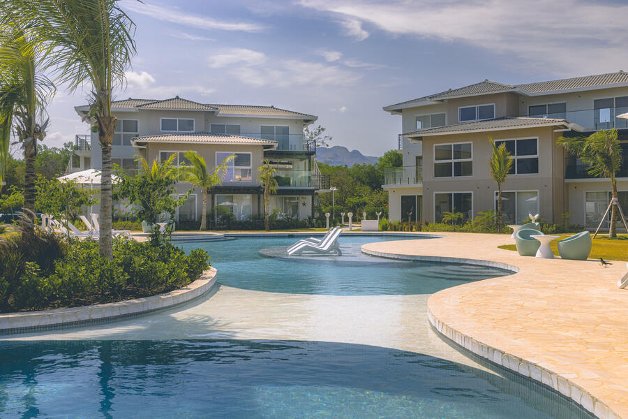 Calm swimming pool surrounded by residences