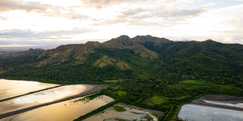 Green mountains and lagoon near Playa Caracol