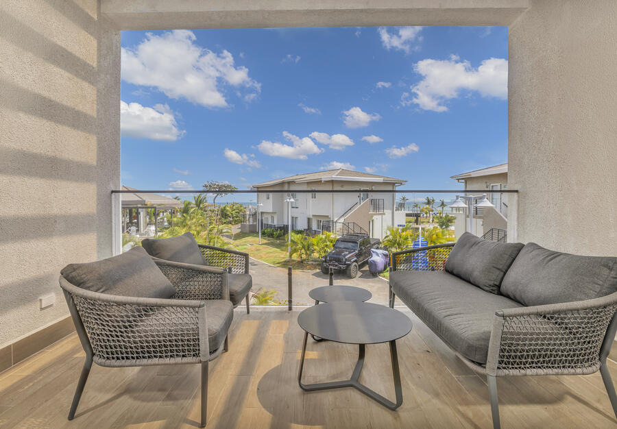 Covered ocean-view terrace lounge, ideal for working remotely