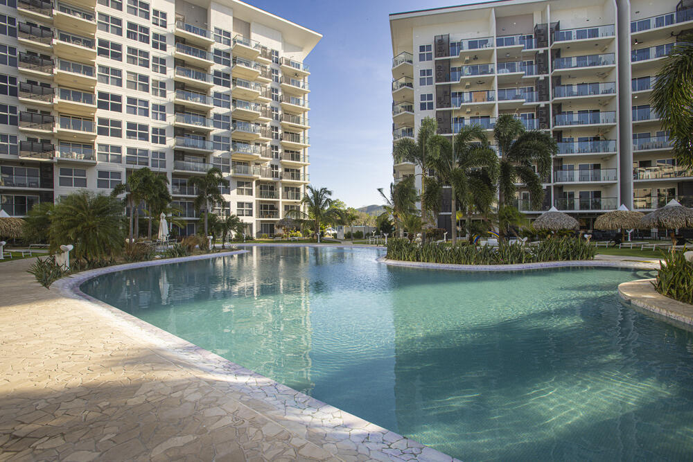 Pool nestled between residences