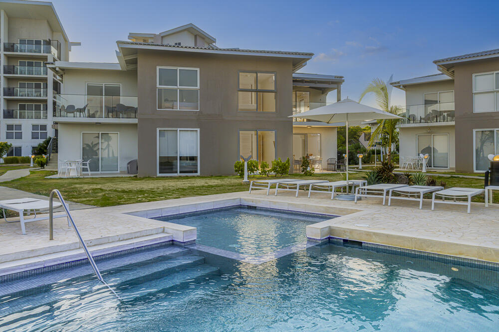 Villa pool and social area at golden hour